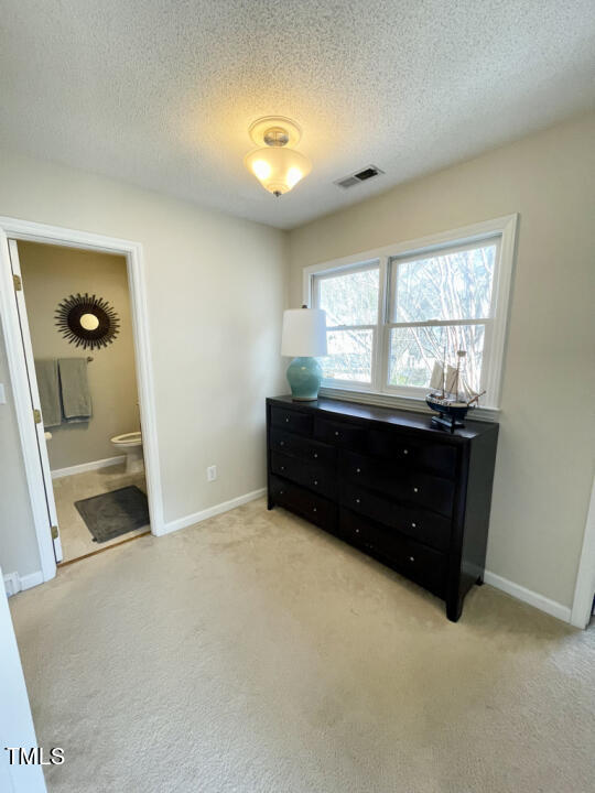 107 Legacy Lane Durham, NC 27713 - Photo 16 of 23 a room with a dresser and a window