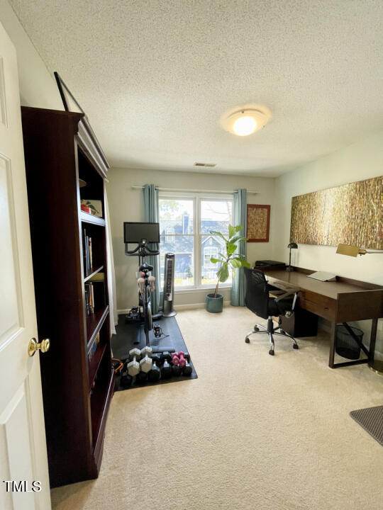 107 Legacy Lane Durham, NC 27713 - Photo 17 of 23 a room with furniture a rug toys and a window
