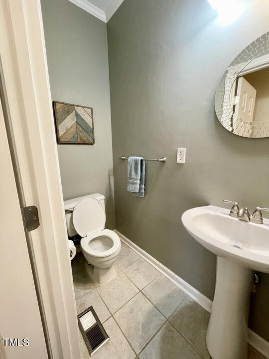 107 Legacy Lane Durham, NC 27713 - Photo 19 of 23 a bathroom with a sink toilet and a mirror