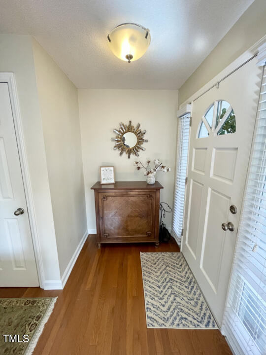 107 Legacy Lane Durham, NC 27713 - Photo 6 of 23 a room with painting and a rug