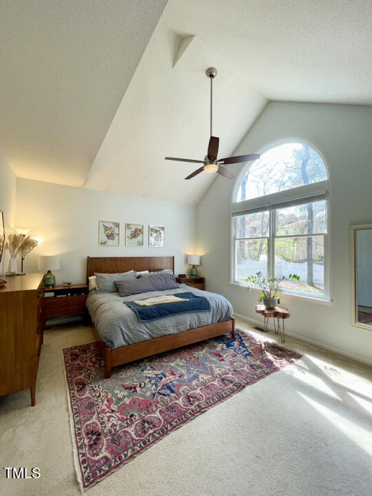 107 Legacy Lane Durham, NC 27713 - Photo 8 of 23 a bedroom with a large bed and wooden floor