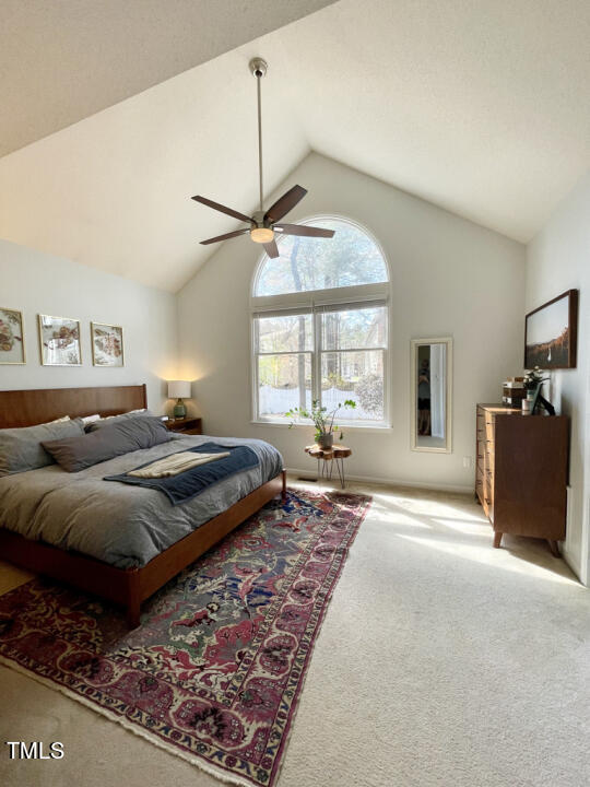 107 Legacy Lane Durham, NC 27713 - Photo 9 of 23 a spacious bedroom with a large bed and a window