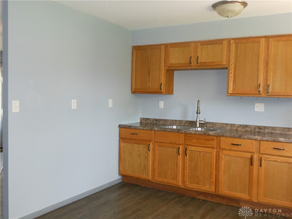 143 West Emerick Road West Milton, OH 45383 - Photo 12 of 37 This bright kitchen features ample cabinetry and a double sink, ready for your culinary adventures.
