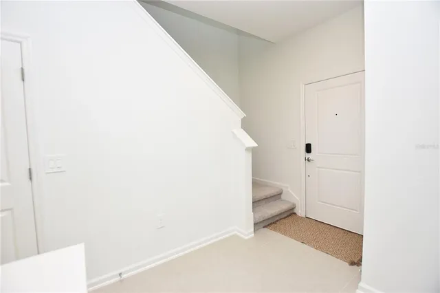 a view of entryway with bathroom