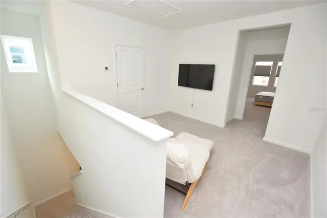 a living room with a couch and a flat screen tv