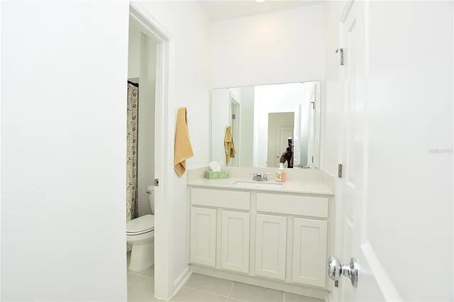 a white bath tub sitting next to a white toilet