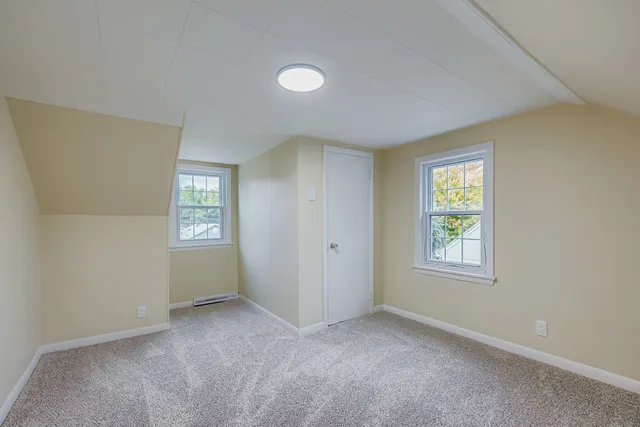 a view of an empty room with windows