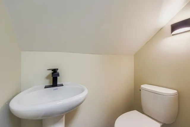 a bathroom with a toilet and a sink
