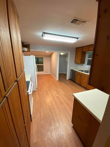 a view of living room with furniture and a window