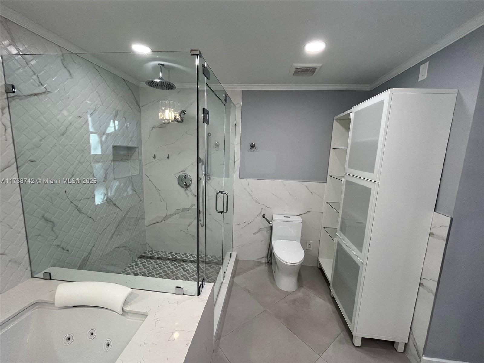 15023 Southwest 139th Place Miami, FL 33186 - Photo 18 of 31 a bathroom with a sink a toilet and shower