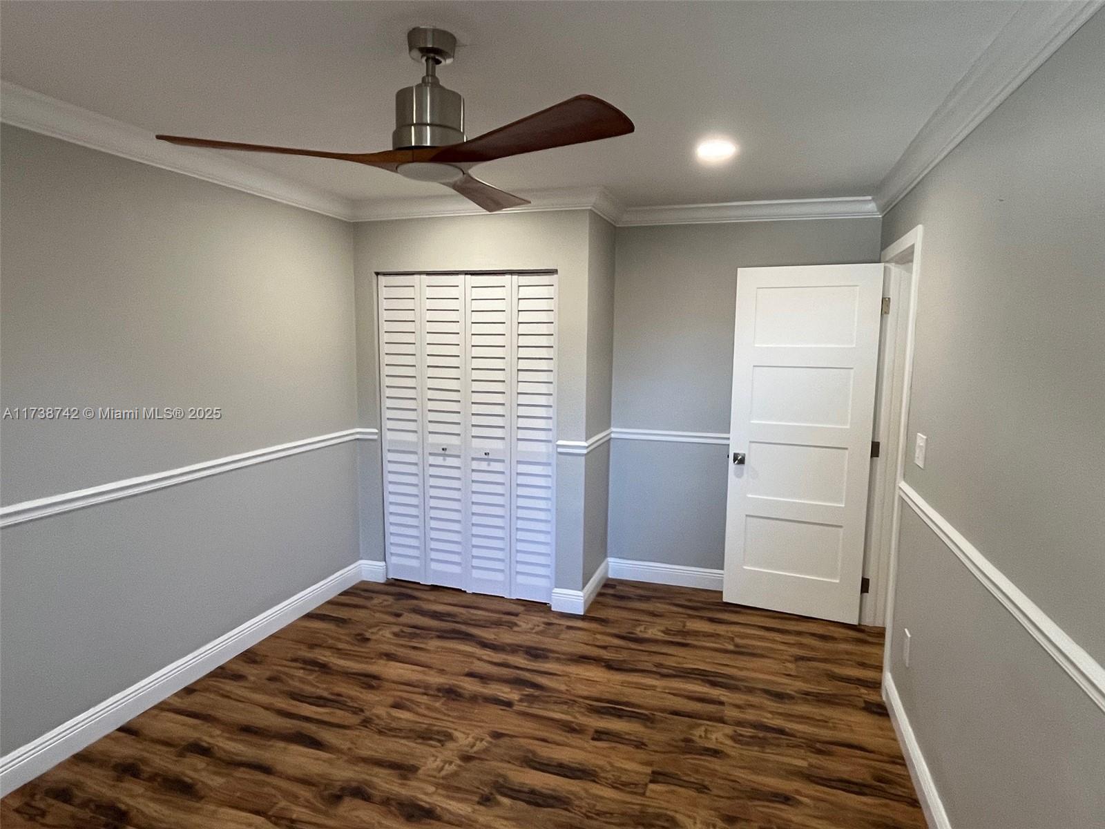 15023 Southwest 139th Place Miami, FL 33186 - Photo 21 of 31 a view of empty room with wooden floor