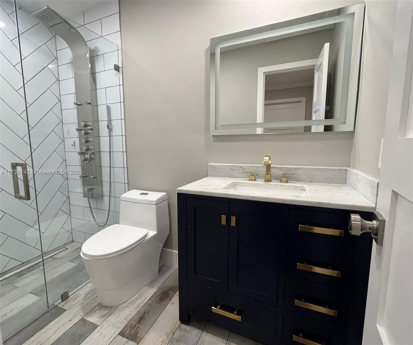 15023 Southwest 139th Place Miami, FL 33186 - Photo 22 of 31 a bathroom with a sink and a toilet