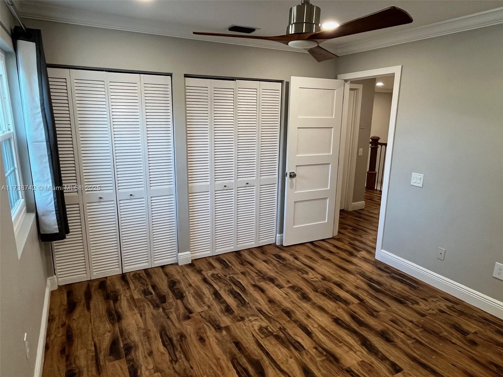 15023 Southwest 139th Place Miami, FL 33186 - Photo 24 of 31 a view of an empty room with a fireplace