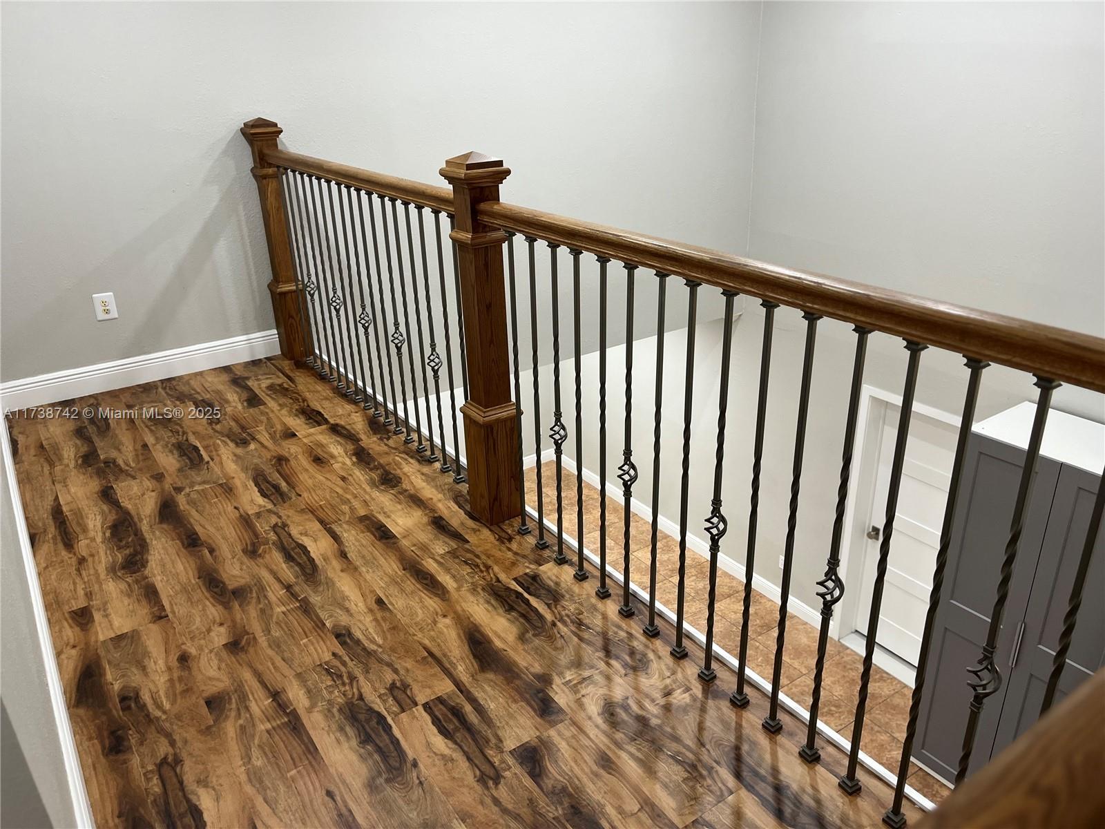 15023 Southwest 139th Place Miami, FL 33186 - Photo 30 of 31 a view of a hallway with wooden floor