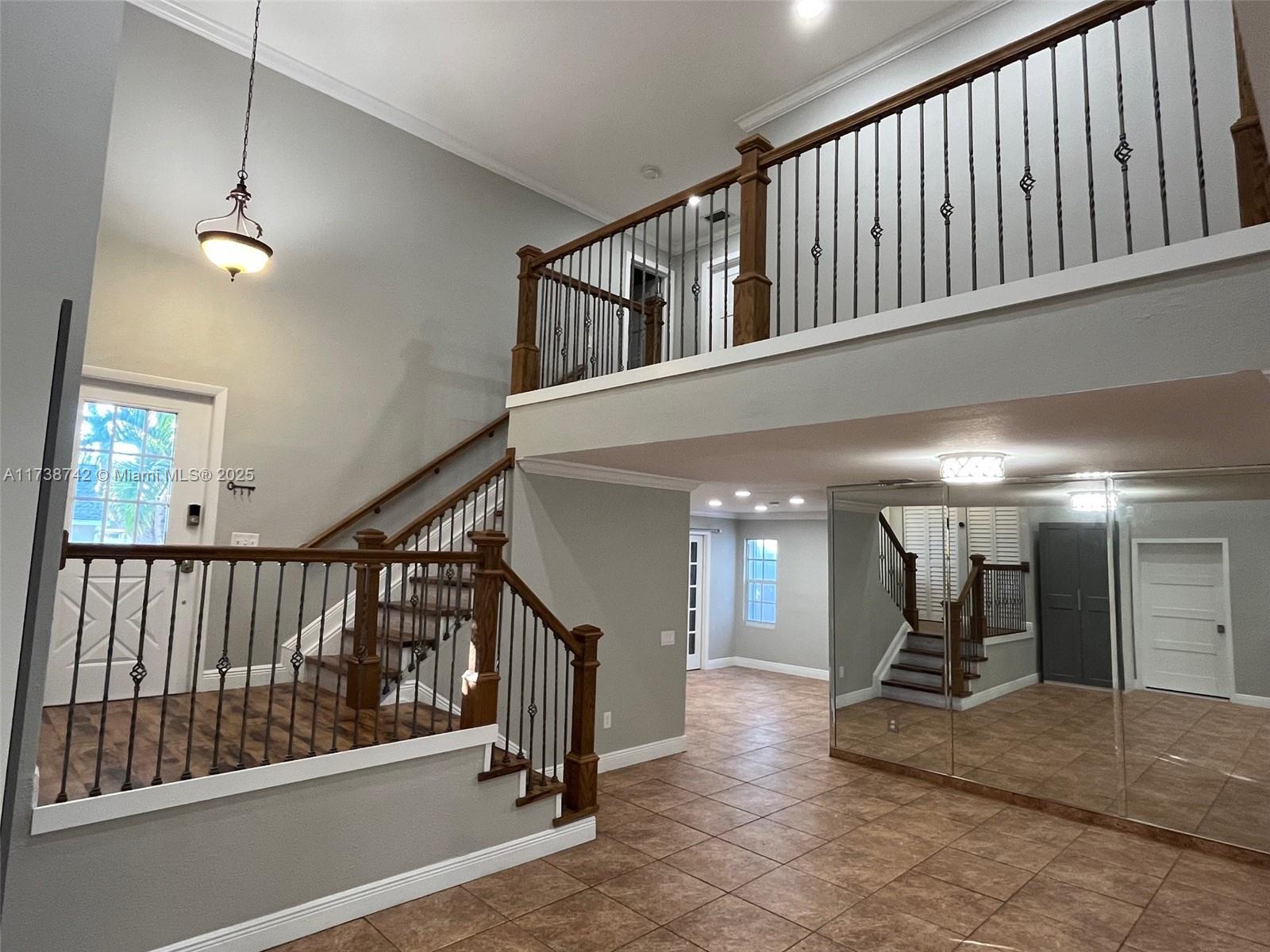 15023 Southwest 139th Place Miami, FL 33186 - Photo 5 of 31 a view of staircase with hallway
