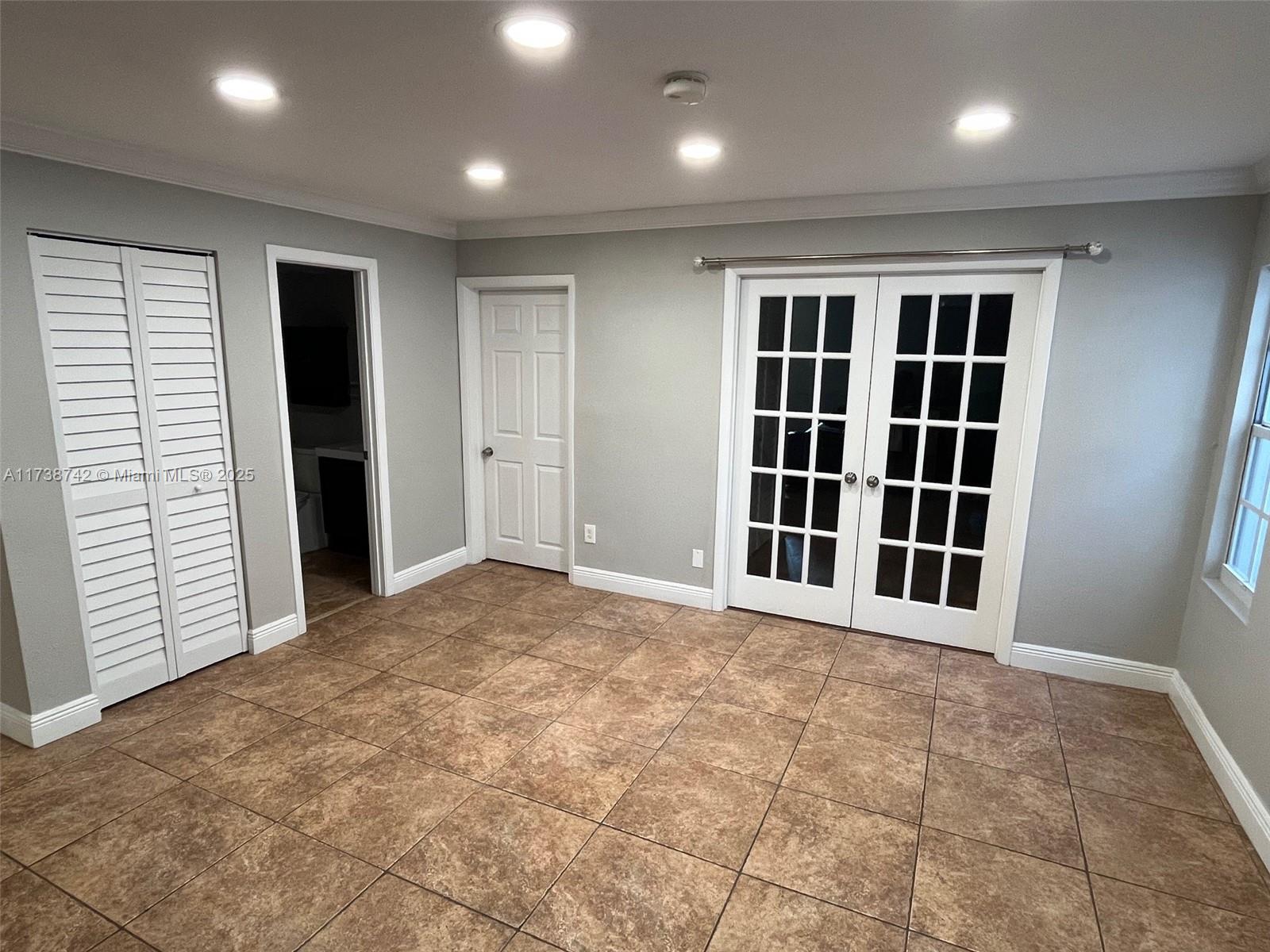 15023 Southwest 139th Place Miami, FL 33186 - Photo 7 of 31 a view of an empty room with a window