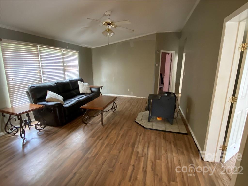 162 Ivester Road Lawndale, NC 28090 - Photo 11 of 16 a living room with furniture and wooden floor