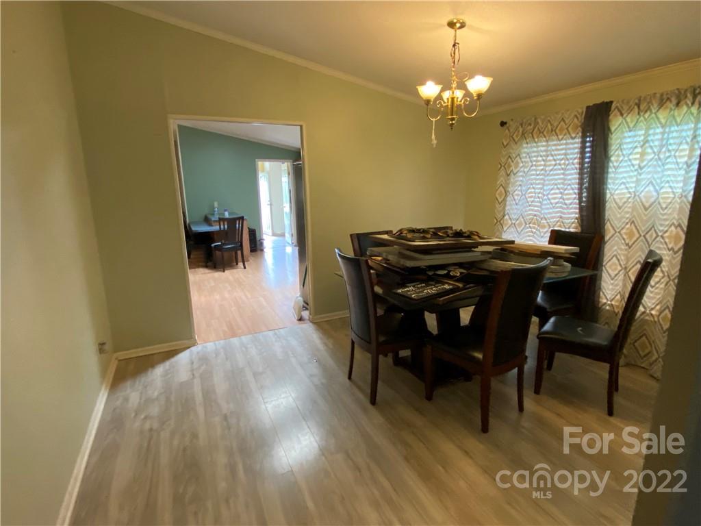 162 Ivester Road Lawndale, NC 28090 - Photo 12 of 16 a view of a dining room with furniture and chandelier