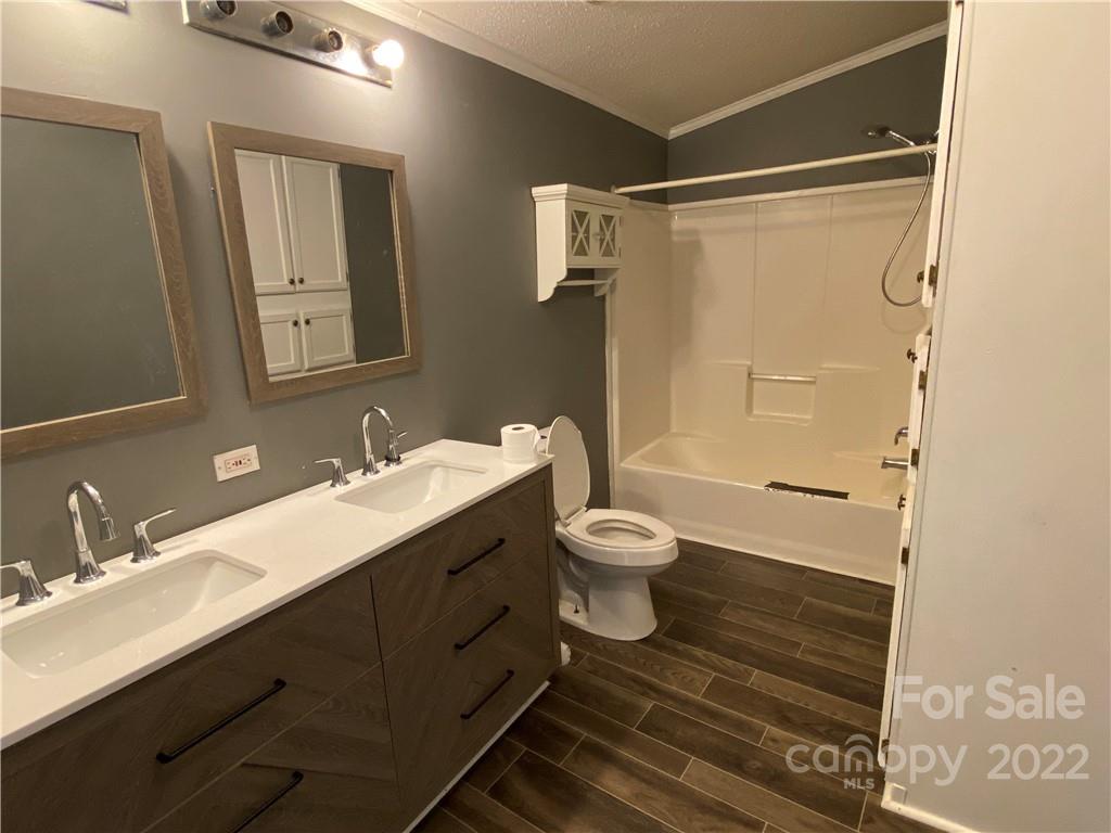 162 Ivester Road Lawndale, NC 28090 - Photo 13 of 16 a bathroom with a sink toilet and shower