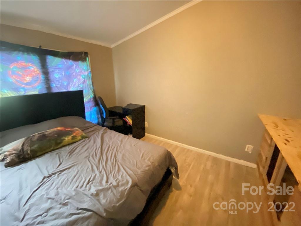 162 Ivester Road Lawndale, NC 28090 - Photo 14 of 16 a bedroom with a bed and a flat screen tv