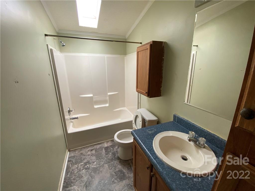 162 Ivester Road Lawndale, NC 28090 - Photo 15 of 16 a bathroom with a sink toilet and shower