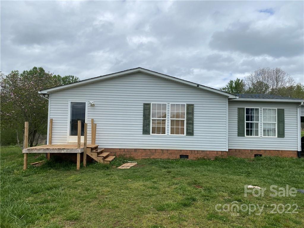 162 Ivester Road Lawndale, NC 28090 - Photo 2 of 16 a view of a house with a backyard