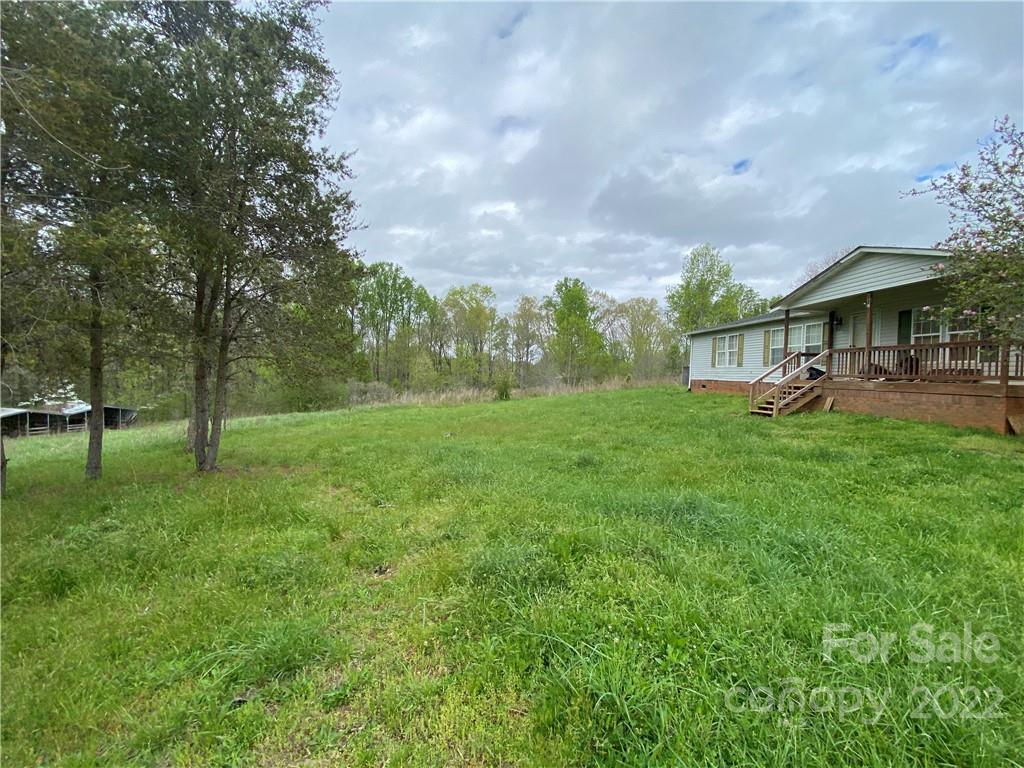 162 Ivester Road Lawndale, NC 28090 - Photo 4 of 16 a view of a big yard with a house