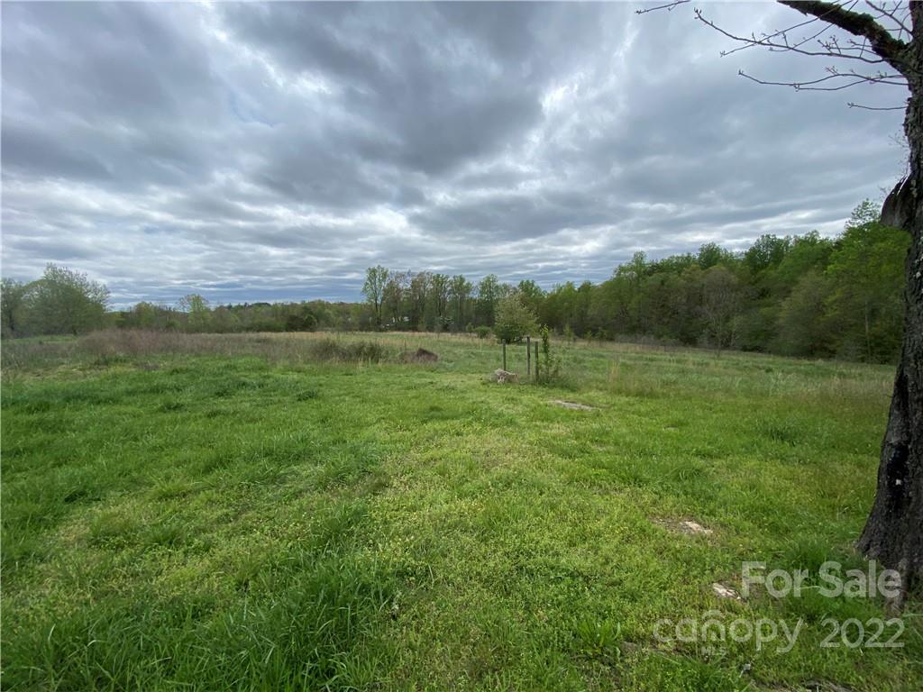 162 Ivester Road Lawndale, NC 28090 - Photo 5 of 16 a view of a field with wooden fence