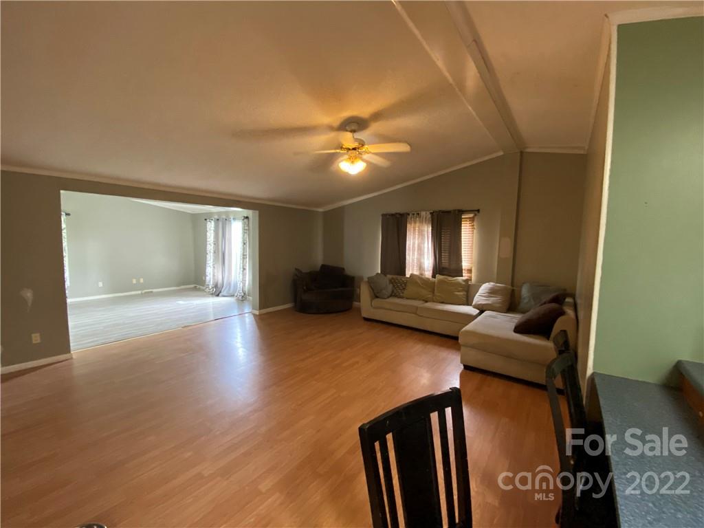 162 Ivester Road Lawndale, NC 28090 - Photo 8 of 16 a living room with furniture and a chandelier