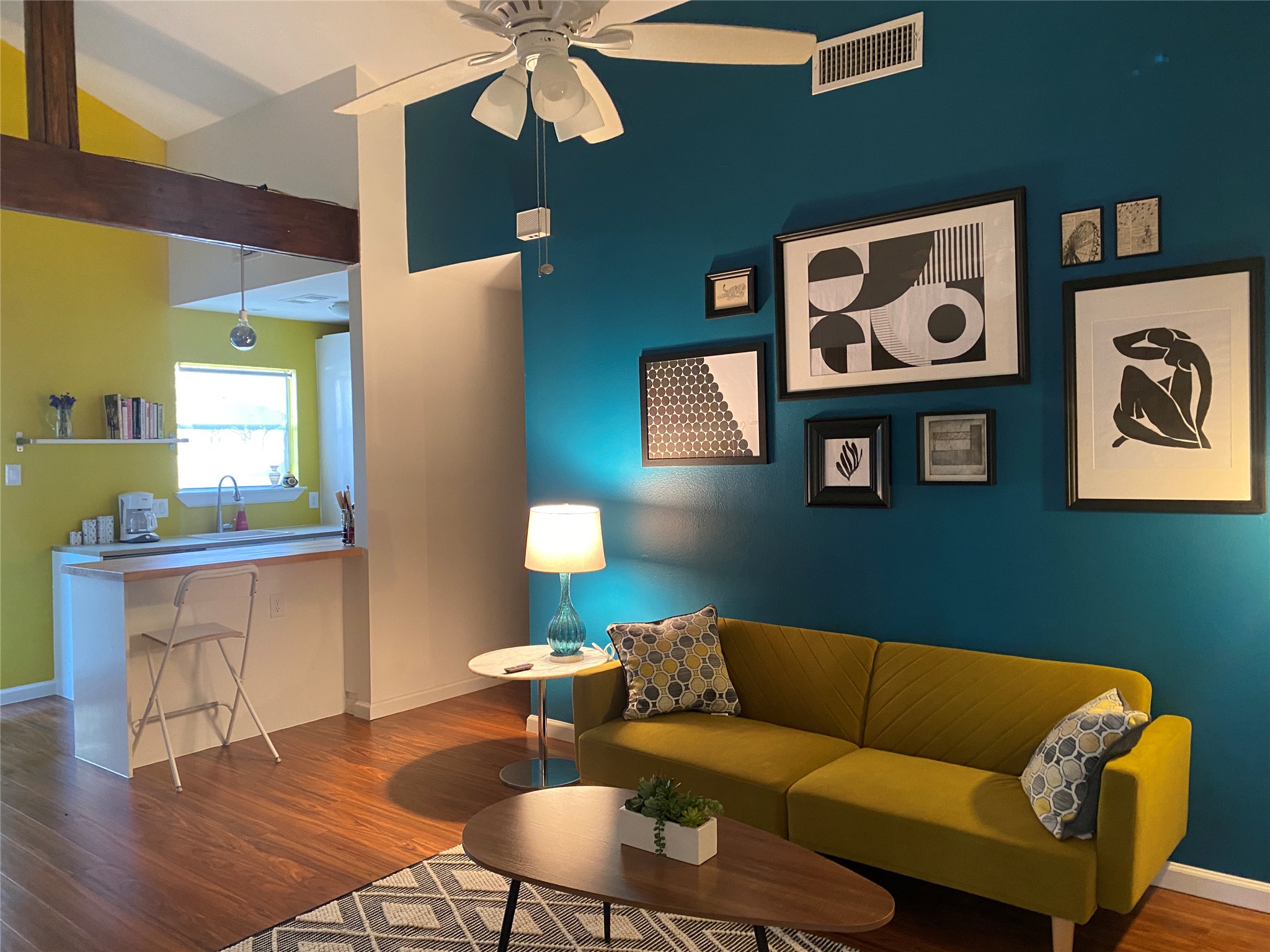 5405 Brompton Circle, Unit B Austin, TX 78745 - Photo 18 of 19 Living area with a ceiling fan, wood finished floors, and high vaulted ceiling