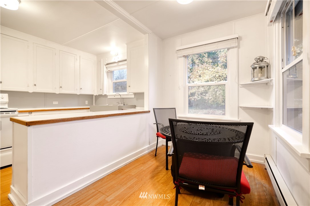 340 Boundary Bay Road Point Roberts, WA 98281 - Photo 6 of 17 a dining room with furniture and a window
