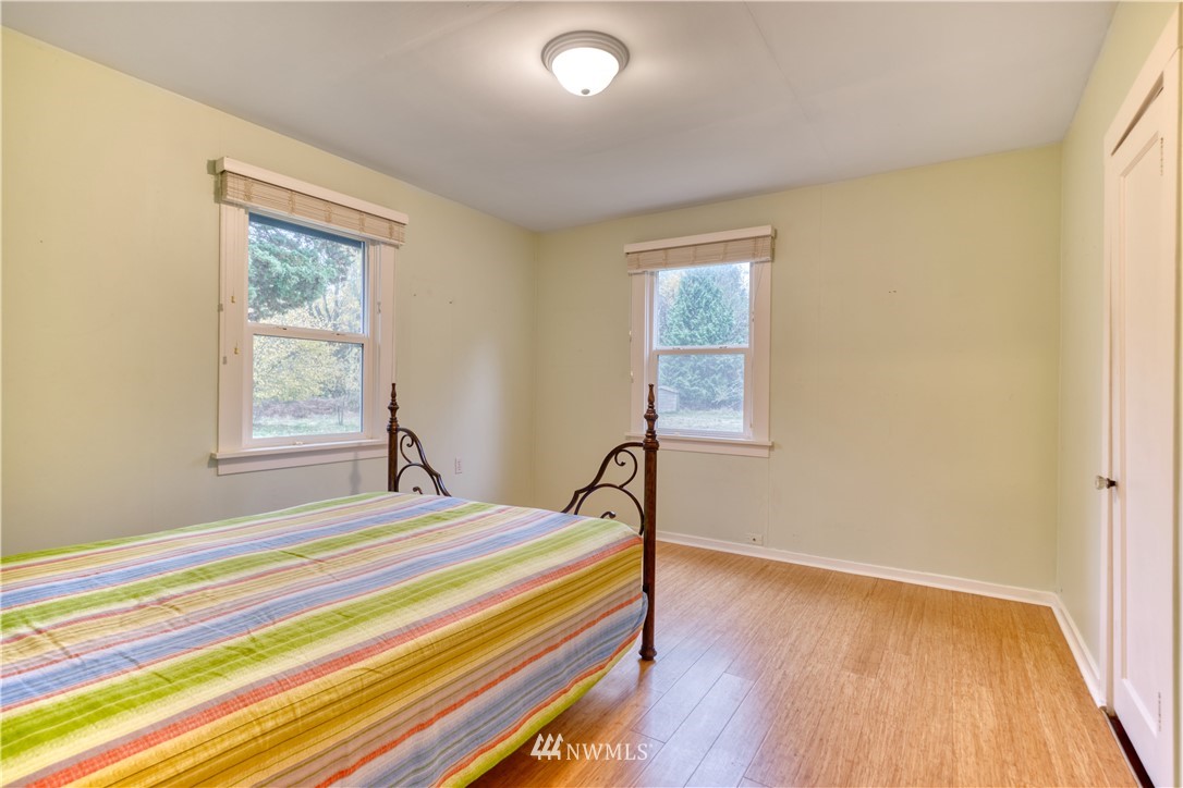 340 Boundary Bay Road Point Roberts, WA 98281 - Photo 10 of 17 a bedroom with a bed and a window
