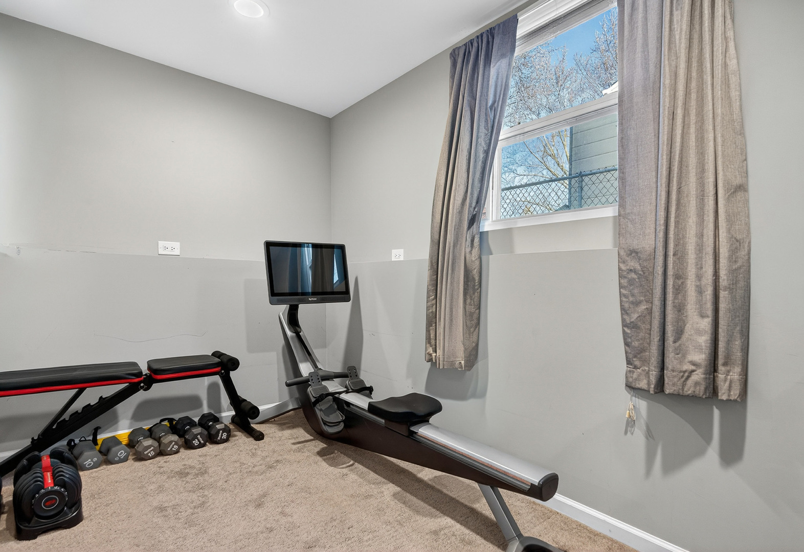 14 Devonshire Circle Elgin, IL 60123 - Photo 15 of 21 a room with gym equipment and a window