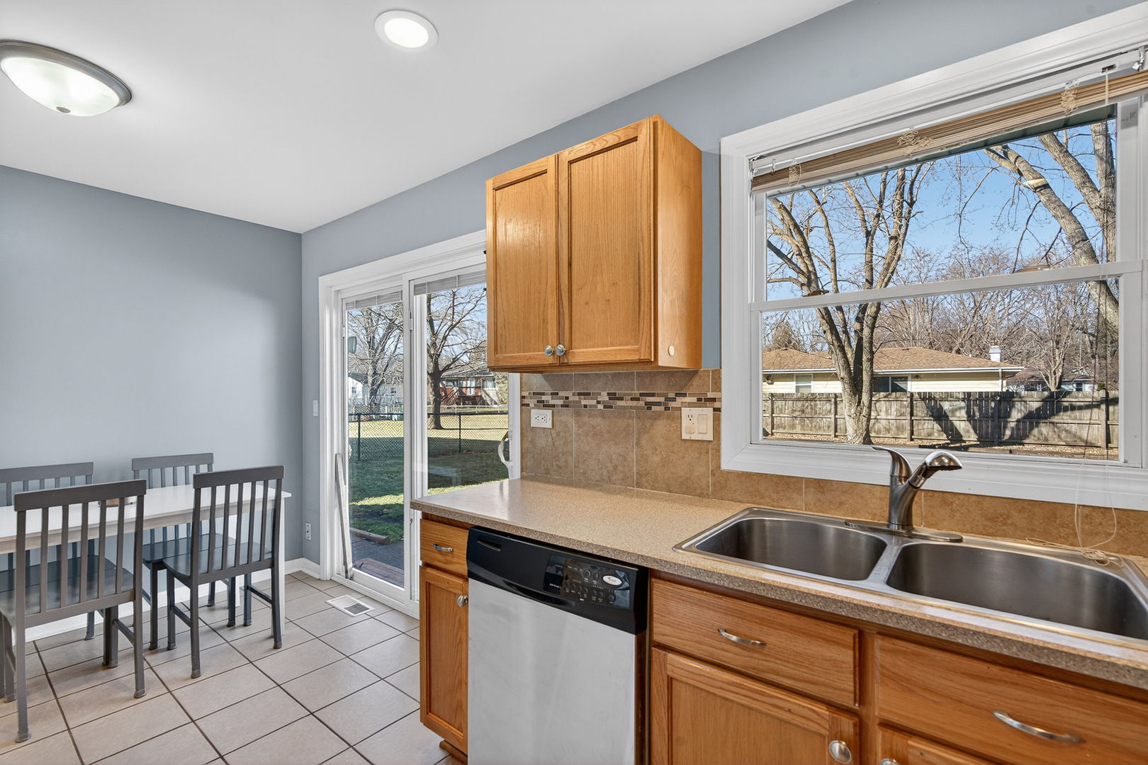 14 Devonshire Circle Elgin, IL 60123 - Photo 7 of 21 a kitchen that has a sink and a large window