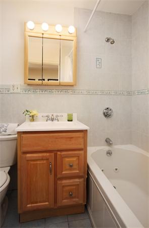 112 Pinckney Street, Unit 4 Boston, MA 02114 - Photo 6 of 6 a bathroom with a sink and a bathtub