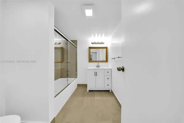 a bathroom with a shower and a toilet