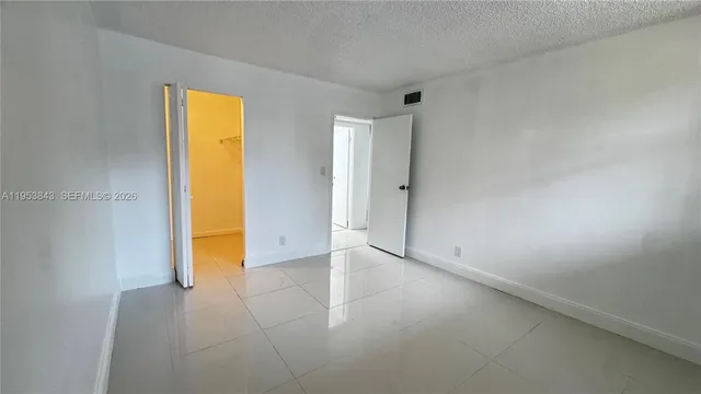 a view of empty room with painted walls