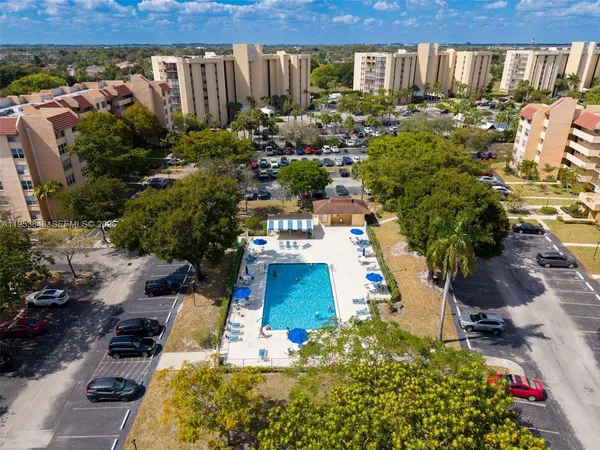 an aerial view of residential building and parking space