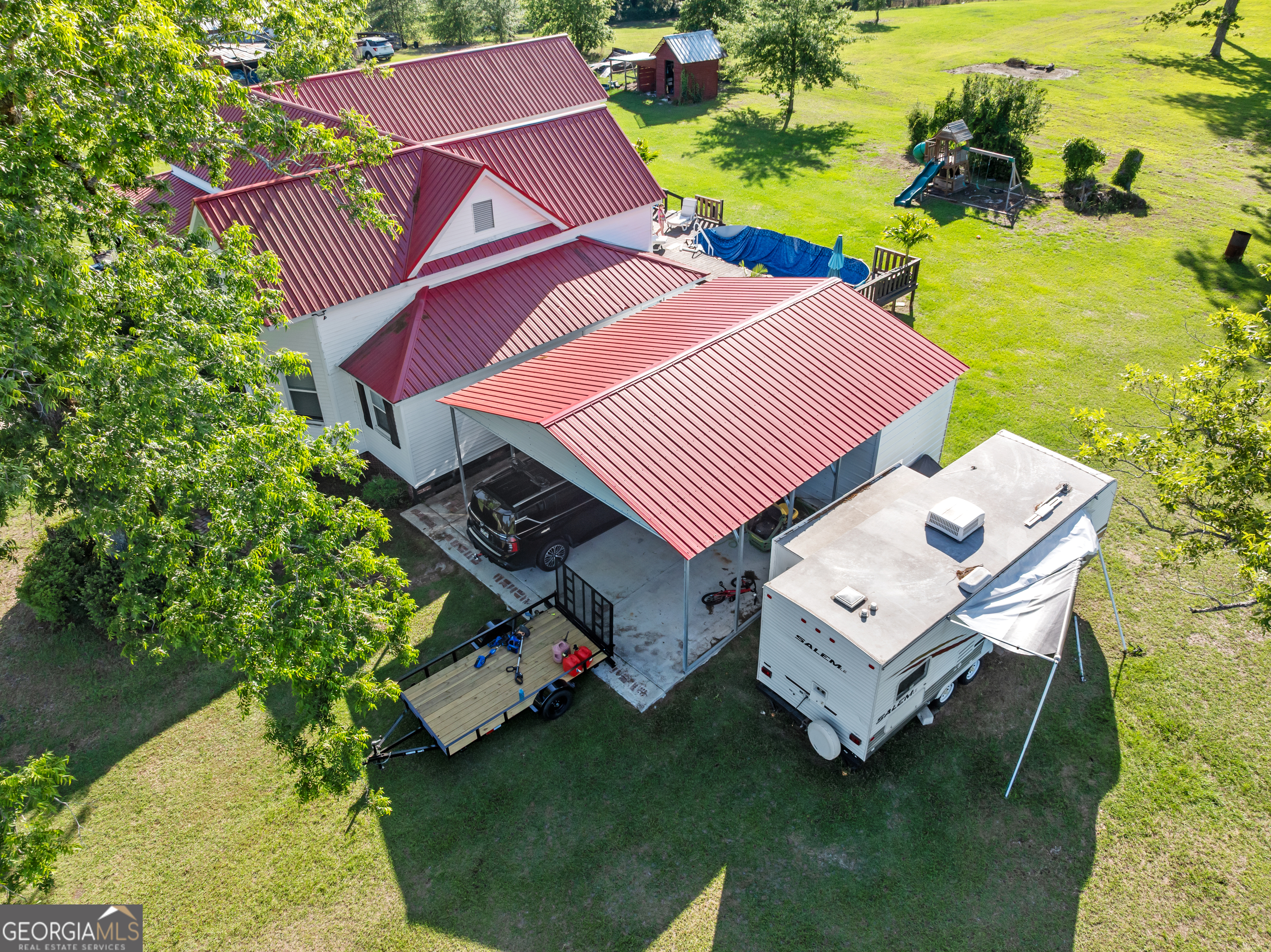 5065 10 Mile Road Baxley, GA 31513 - Photo 61 of 70 an aerial view of a house with swimming pool and lake view