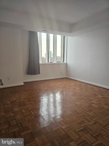 a spacious bathroom with a sink and a mirror