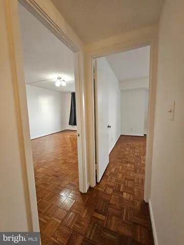 an empty room with large windows