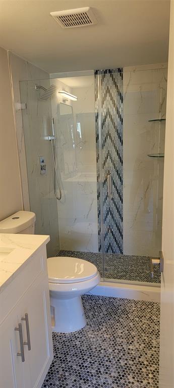 4829 Sable Pine Circle, Unit 1C West Palm Beach, FL 33417 - Photo 5 of 16 a bathroom with a bathtub and shower