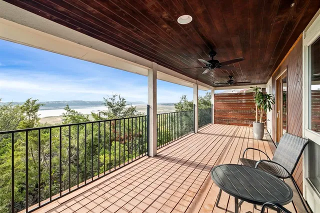 a view of a balcony with furniture