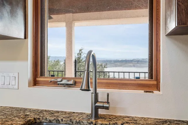 a view of a living room and floor to ceiling window