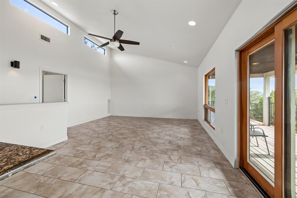 3160 Thurman Road, Unit A Lago Vista, TX 78645 - Photo 16 of 30 wooden floor in an empty room with a window