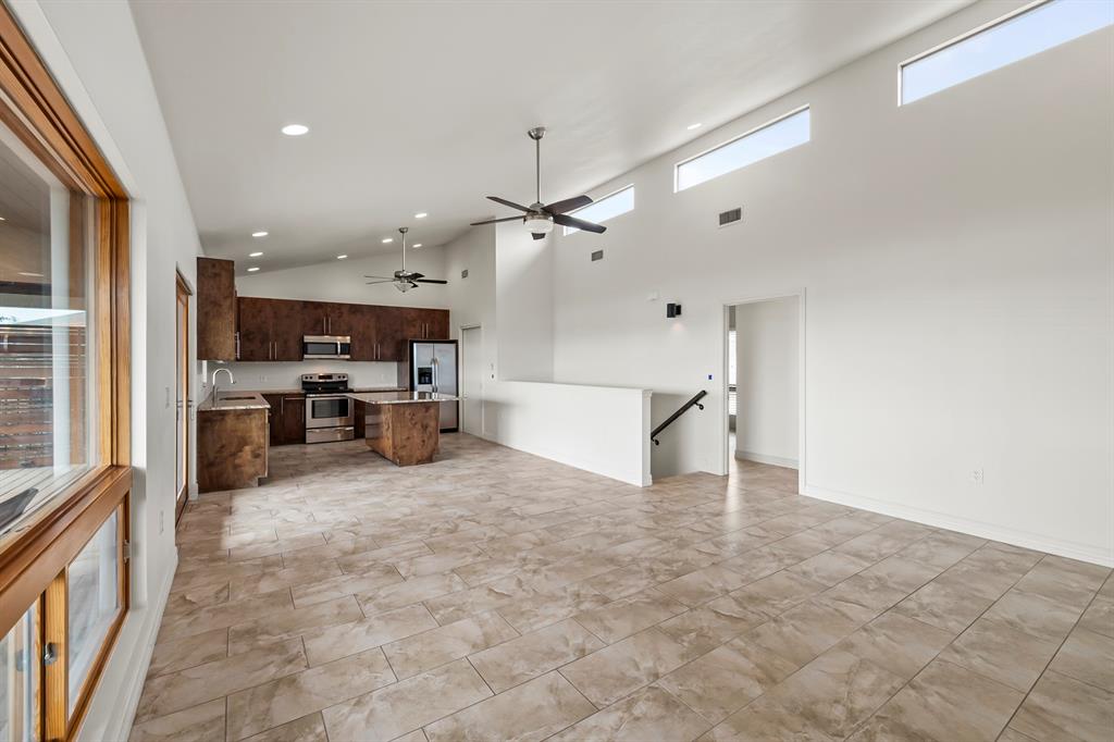 3160 Thurman Road, Unit A Lago Vista, TX 78645 - Photo 18 of 30 a view of a kitchen with furniture and a ceiling fan