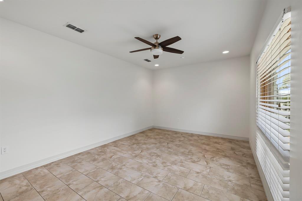 3160 Thurman Road, Unit A Lago Vista, TX 78645 - Photo 20 of 30 an empty room with a window and a ceiling fan