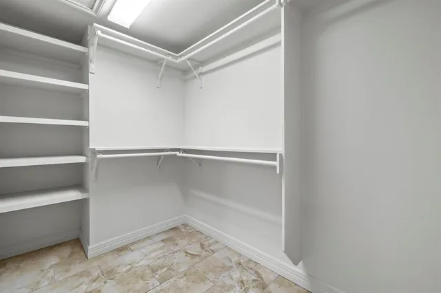 a view of an empty walk in closet