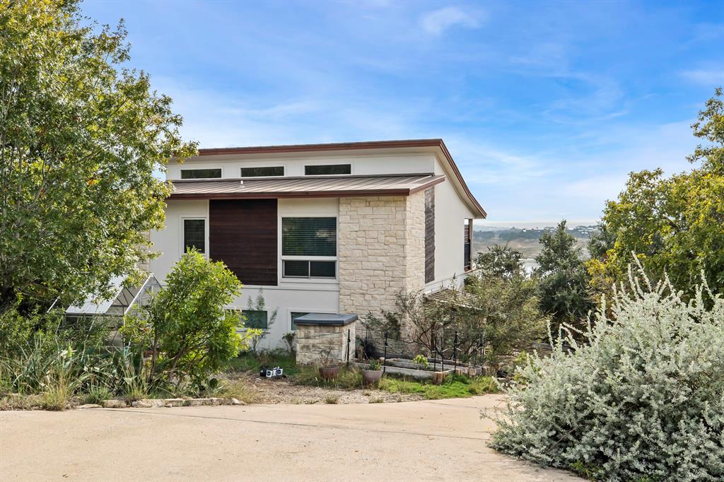 3160 Thurman Road, Unit A Lago Vista, TX 78645 - Photo 4 of 30 front view of a house with a yard