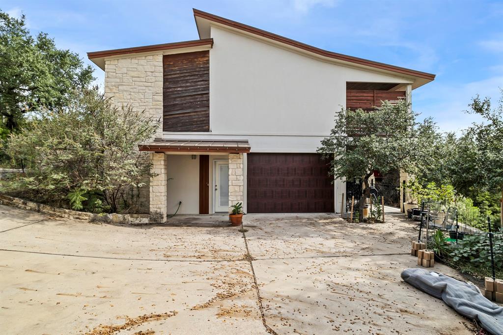 3160 Thurman Road, Unit A Lago Vista, TX 78645 - Photo 6 of 30 a front view of a house with a yard